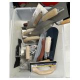 Concrete finishing tools in tote
