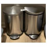 2 small step-on stainless trash cans