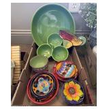 Large flat of colorful ceramic serving dishes