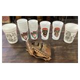 Old baseball glove and plastis sports cups