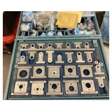 Box of machined parts from PIC Design Corp