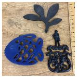 3 cast-iron trivets