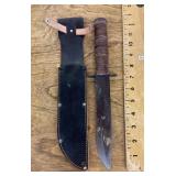 Fixed blade knife with leather wrapped handle