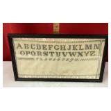 Framed cross stitch sampler