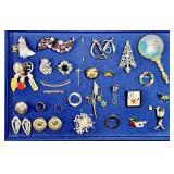 Costume jewelry brooches, rings, barrettes,