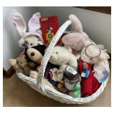 Large white basket filled with plush animals