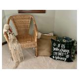 Wicker armchair, throw pillows, piano shawl