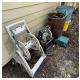 2 hose reels, hose, trash cans, bird feeder,