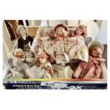 Box of vintage storybook dolls