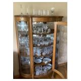 Contents of curved glass cabinet