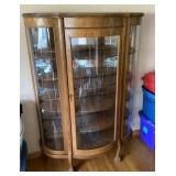 Curved glass clawfoot curio cabinet with key