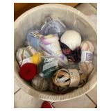 Large laundry hamper full of yarn