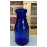 Cobalt blue glass milk bottle
