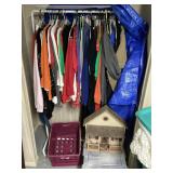 Clothes rack and clothes and decor in closet