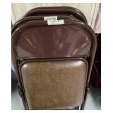 Set of 4 brown metal folding chairs