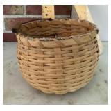 Signed woven basket with bail handle