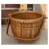 Woven basket with wood bottom