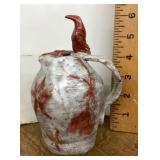 Studio pottery pitcher with bird