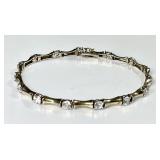 Gold over sterling tennis bracelet w/clear stones