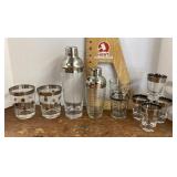 Silver trimmed bar shakers and glasses