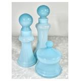 Powder blue glass vanity bottles and powder jar