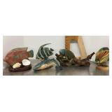 Decorative fish and iguana figures
