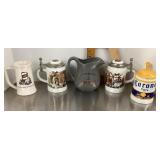 4 beer steins and pitcher