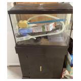 Aquarium on cabinet  with supplies