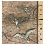 Set of brass bird wall hangings