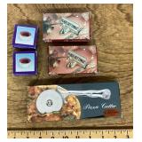 Silverplate pizza cutter, place cards, wine collar