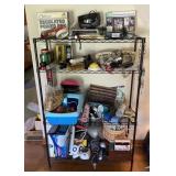 Black metal shelf with contents