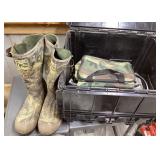Pair of camo boots and hunting gear