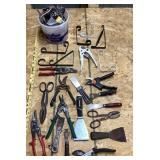 Assorted hand tools and brackets