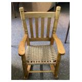 Child's rocking chair with woven seat