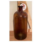 Tall amber glass bottle