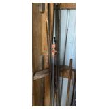 Threaded poles, clamp, and tool in corner