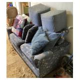 Floral sofa, ottomans, and pillows