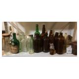 Bottles, jars, tins on shelf