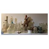 Bottles, jars, insulators, etc. on shelf