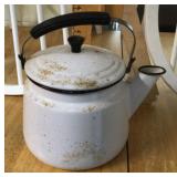 White enamelware teakettle