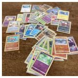 Collection of Pokï¿½mon cards in sleeves