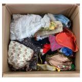 Box of Barbie doll clothes
