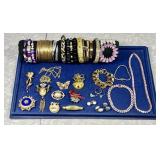 Costume jewelry brooches, necklaces, bracelets