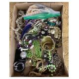 Flat of costume jewelry