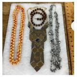 4 costume jewelry necklaces