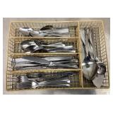 Stainless flatware in organizer basket