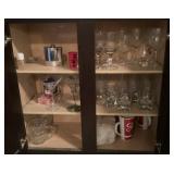 Contents of lower cabinet with glassware