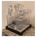4 glass decanters on tray