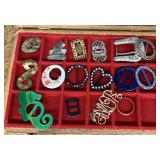 Costume jewelry and belt buckles