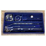 Collection of costume jewelry with tray